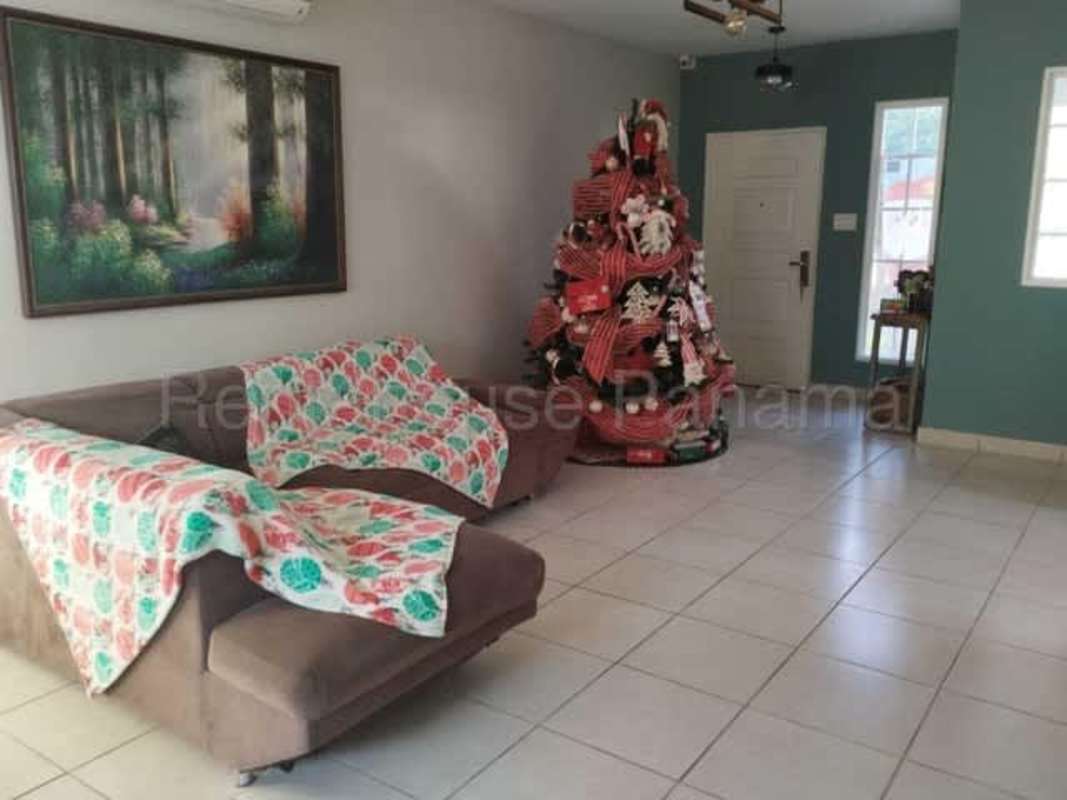 Bedroom with accent wall, vanity, and built-in closet in house for sale Brisas del Golf Panama