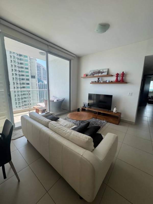 Comfortable furnished bedroom featuring large windows, city skyline views in PH Dupont Punta Pacifica Panama
