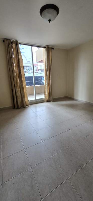 Bedroom with split air conditioning, closet space and tiled floors in PH San Francisco.