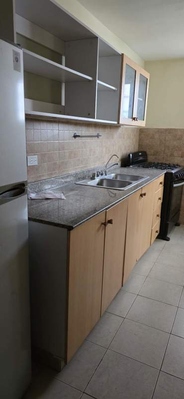 Bedroom with tile floors, sliding glass door to balcony, and AC PH San Francisco Panama.