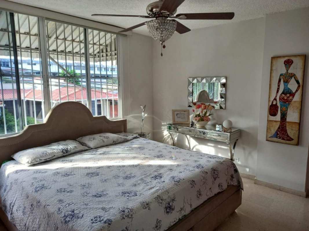 Second bedroom with wooden built-in closets city view PH El Carmen Panama
