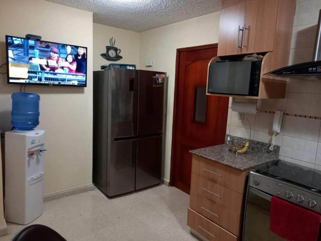 Modern apartment kitchen granite countertop wood cabinets PH El Carmen Panama