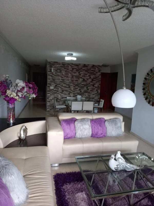 Bright bedroom with large windows mirrored vanity ceiling fan PH El Carmen Panama