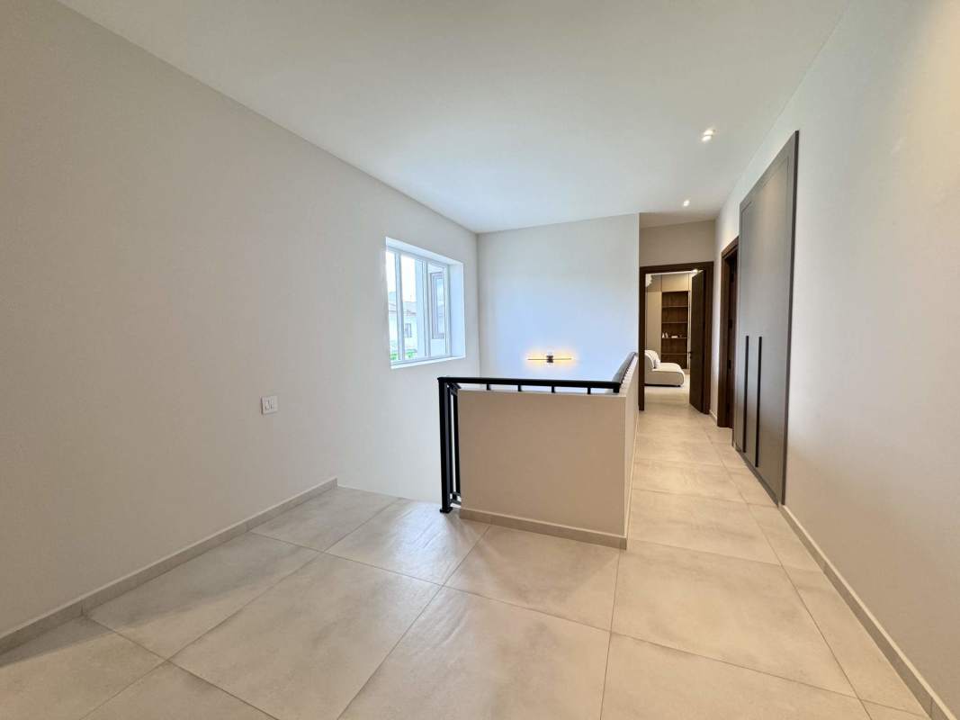 Contemporary kitchen with center island, imported cabinetry, granite countertops and high-end appliances in The Woods Panama