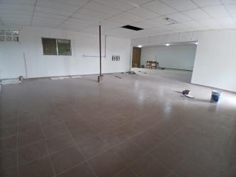 Interior of commercial space in construction with tiled floor and white walls for rent in Chorrera Panama