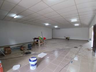 Rear patio area with partial roof ideal for service area commercial property for rent