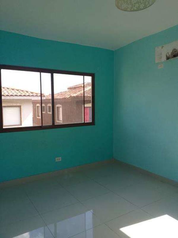 Mediterranean style townhouse with covered carport tiled roof PH Green Village San Miguelito Panama