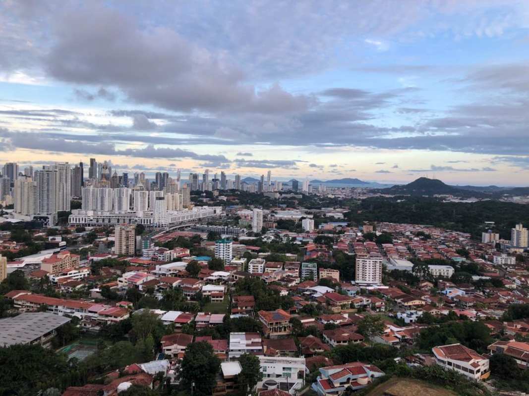 Modern entryway in Dos Mares apartment with contemporary wall art and finishes