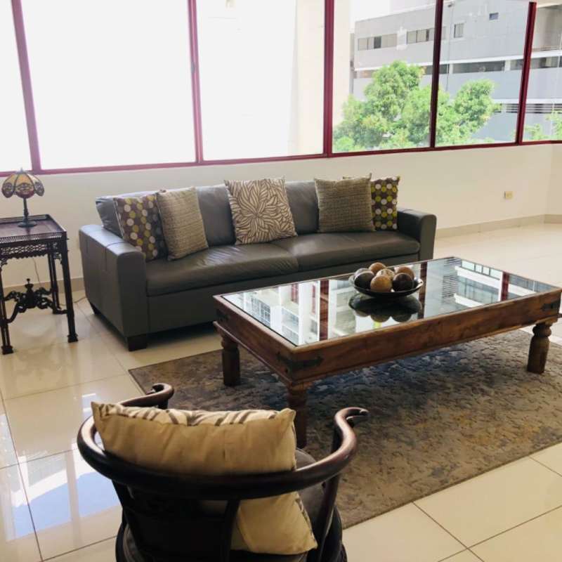 Modern dining room with large corner windows overlooking Panama Bay in PH BICSA Tower