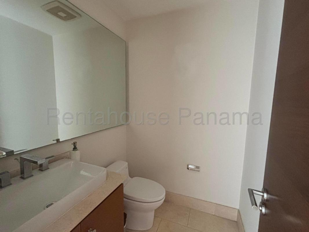 Balcony with glass railing overlooking Santa María Golf Course and skyline Panama