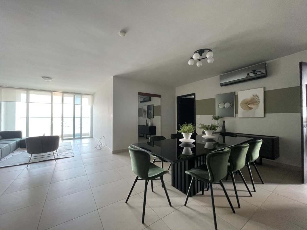 Contemporary dining room with panoramic windows and modern decor in PH Green Garden Costa del Este Panama
