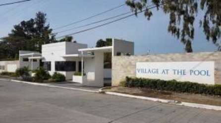 Elegant gated entrance with control access at Village at The Pool residential Río Hato Panama