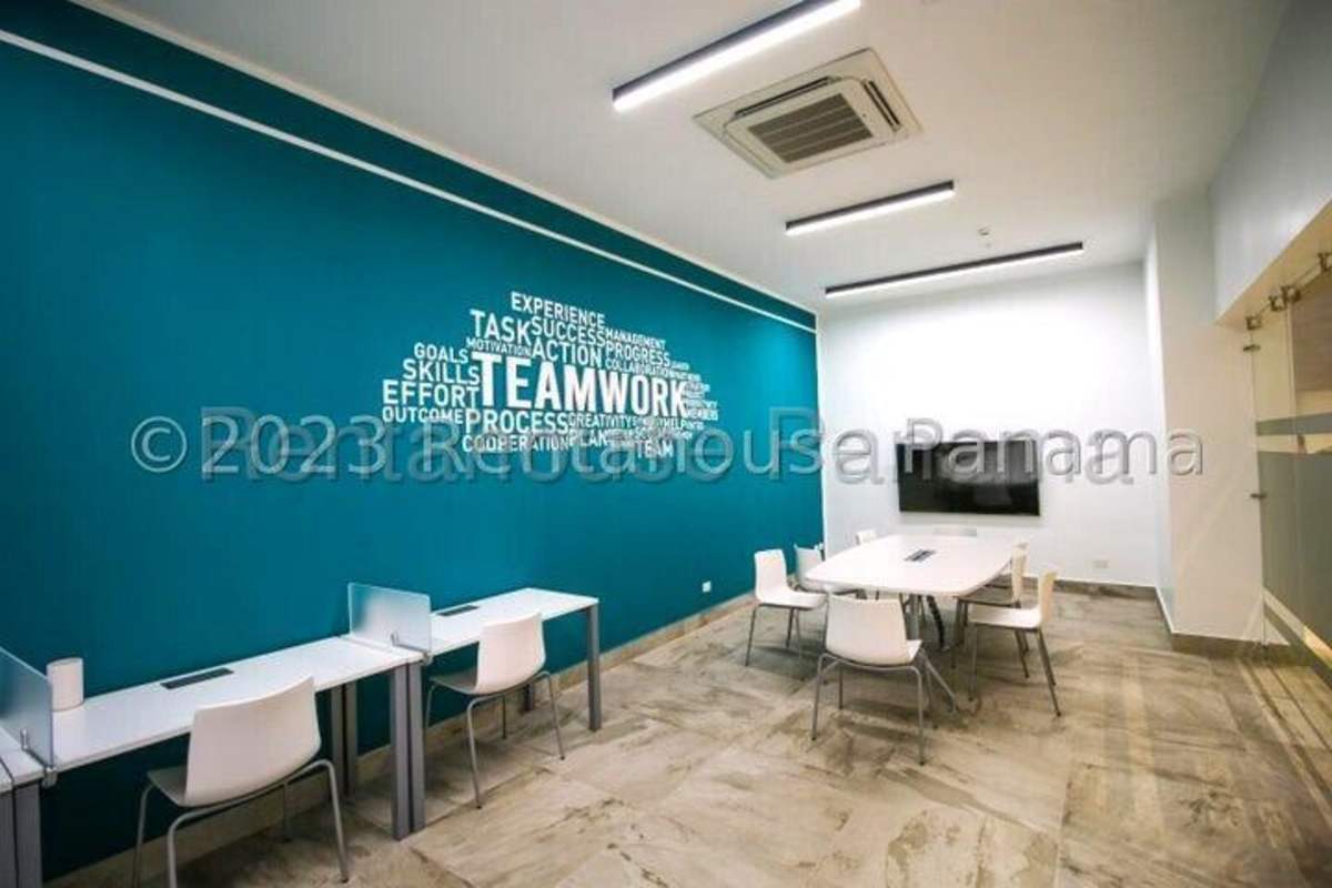 Bright open living-dining room with panoramic windows at Altamira Residences Panama City