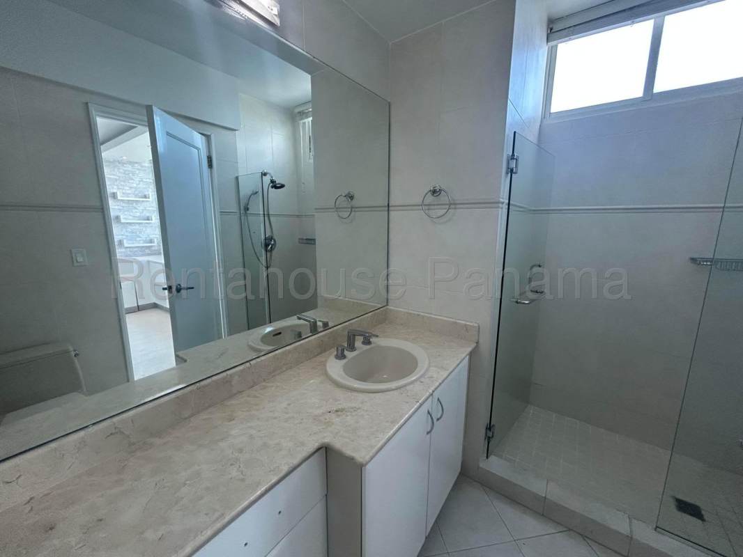 Luxurious bathroom with marble walls, jacuzzi tub, glass shower in PH Peninsula Punta Paitilla Panama