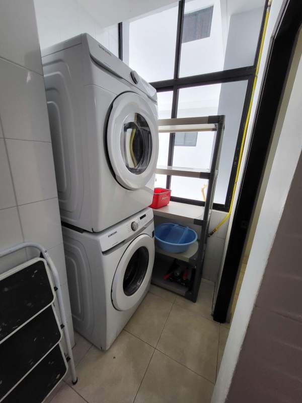 Bedroom with large window offering skyline vistas Dos Mares Panama apartment sale