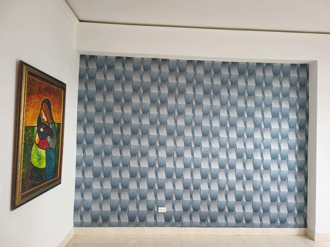 Living room with panoramic windows and city views in PH Dos Mares Tower Panama City