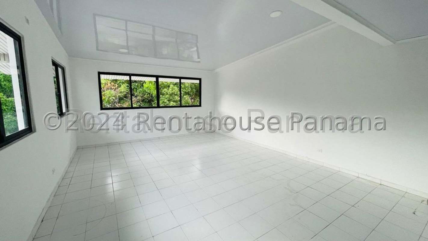 Bright living space with large windows and glossy ceiling in Panama house rental