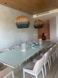 Modern living room sectional sofa natural light luxury condo Playa Escondida