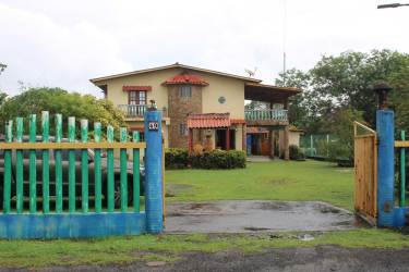 Private swimming pool with blue privacy fence in backyard Nueva Gorgona Panama