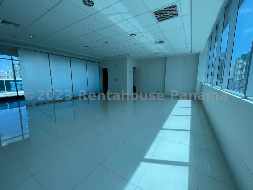 Natural light filled office with tiled floors and glass partition Obarrio