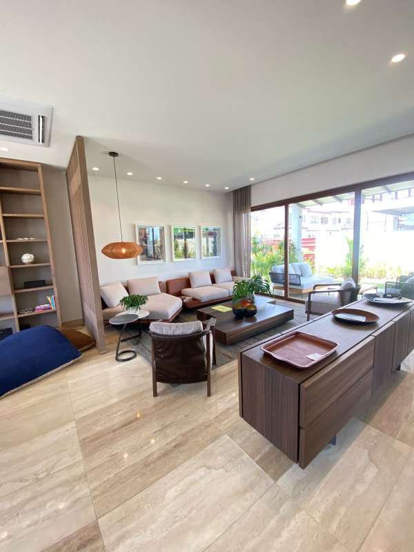 Living area with large sliding doors to patio garden view Santa Maria Golf Panama City