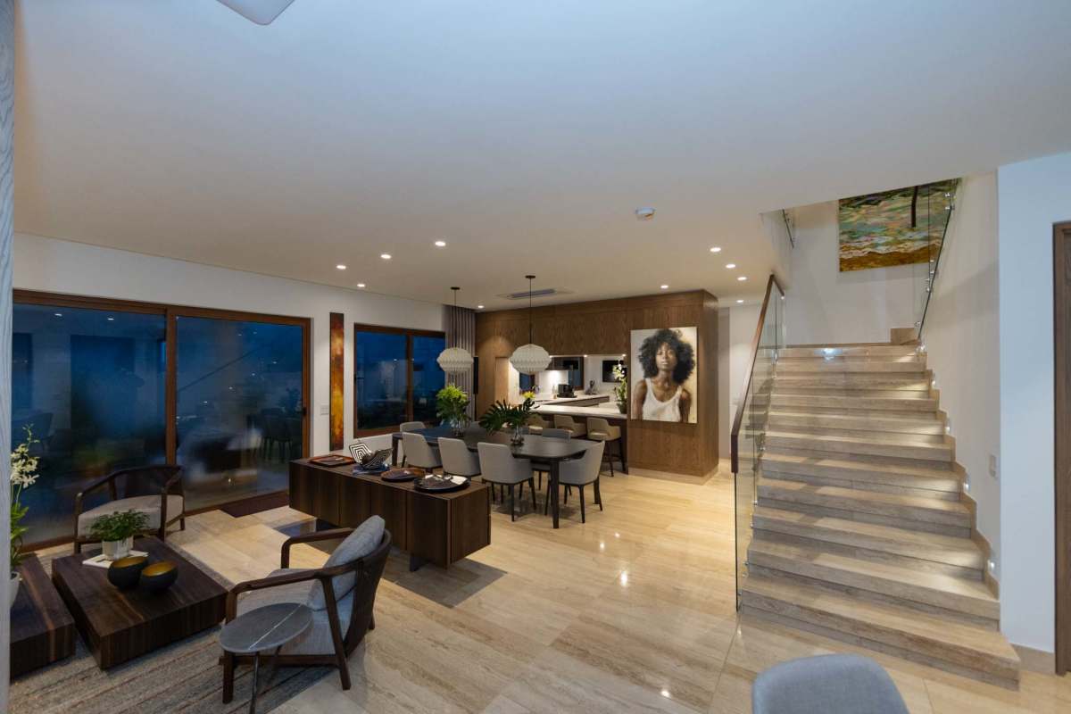 Modern open plan living and dining area with marble floors and panoramic windows Santa Maria Panama