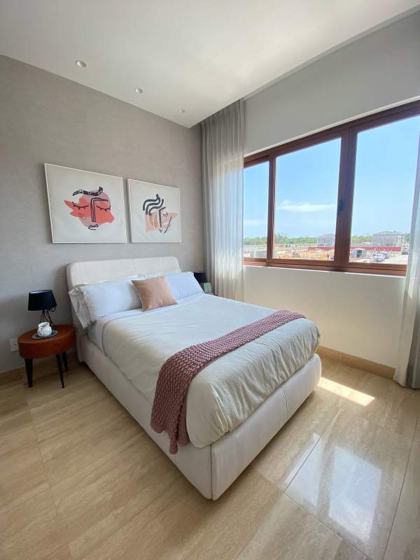 Master suite with city views, king bed, modern decor Santa Maria Golf Panama