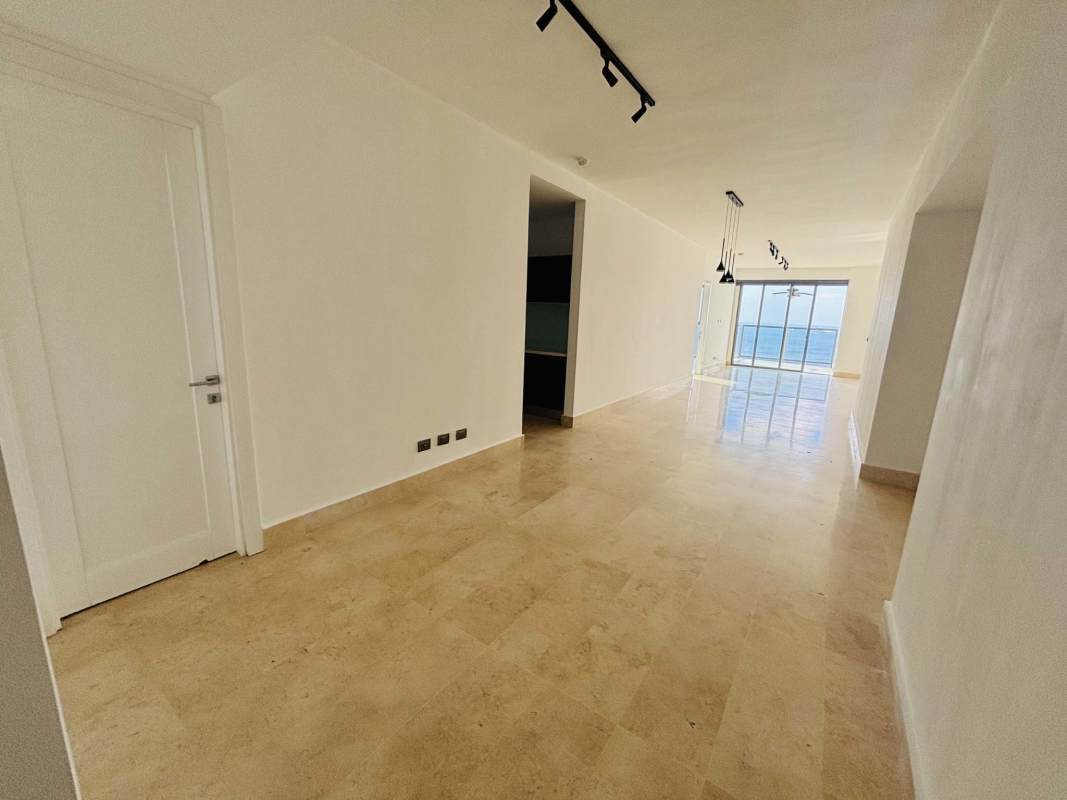 Spacious open living and dining area with natural light and ocean views at Yoo Panama