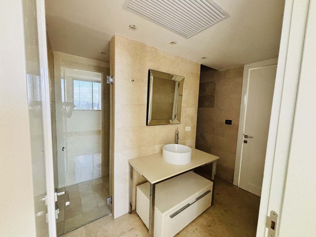 Luxurious lobby lounge with designer bookshelves and seating at Yoo Panama