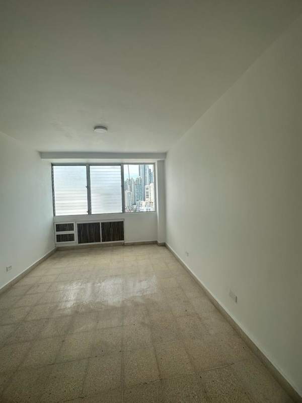 Balcony with glass railing overlooking Pacific Ocean and Panama City skyline in PH Plaza Paitilla