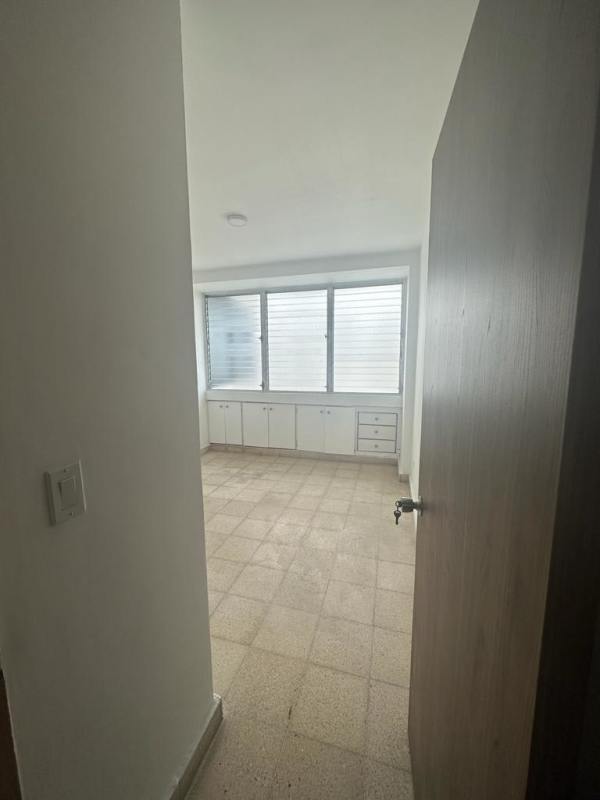 Large master bedroom with built-in closets, tiled floors and skyline view in PH Plaza Paitilla Panama