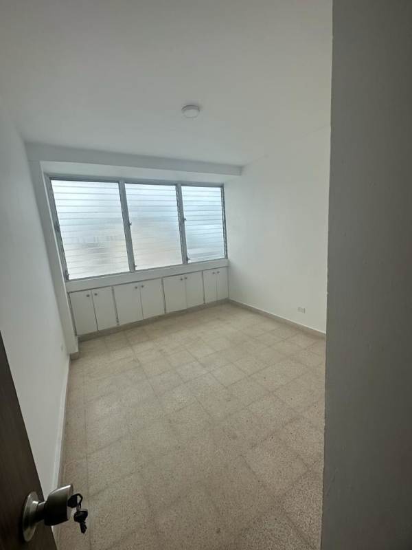 Closed kitchen with marble tile floors, wood cabinets, breakfast area at Plaza Paitilla Panama