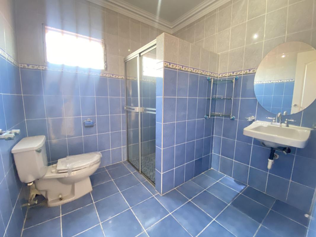 Remodeled kitchen with granite island, wood cabinets in San Antonio Panama