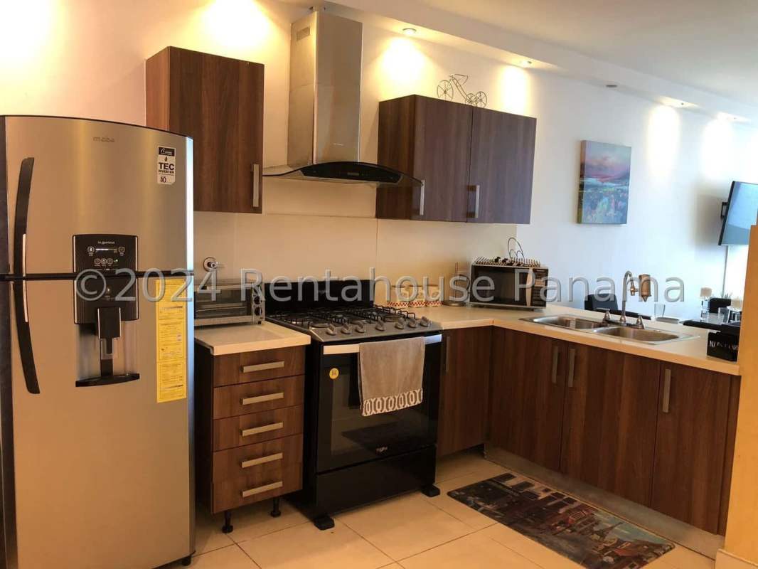 Modern kitchen with granite countertops, stainless appliances in Punta Pacifica Panama