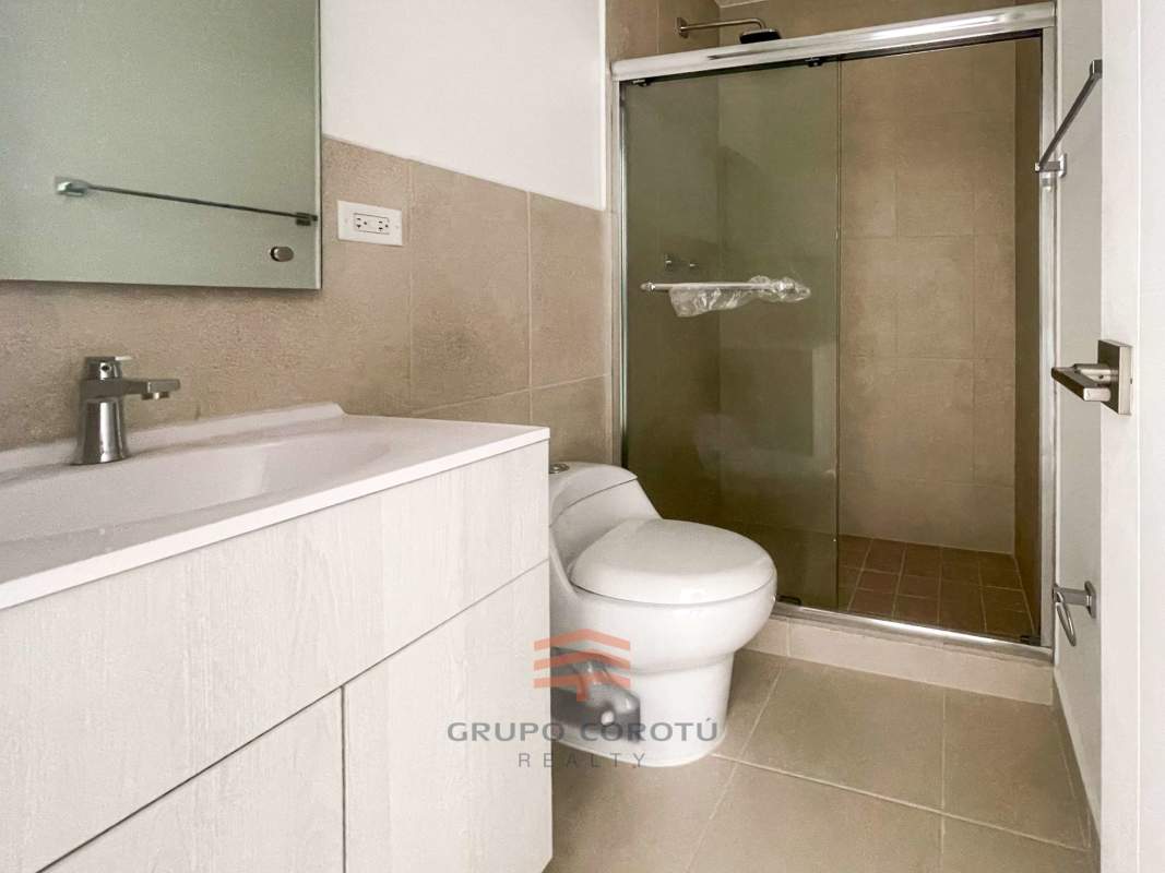 Bright bedroom with closet and tile flooring Costa Sur Panama house