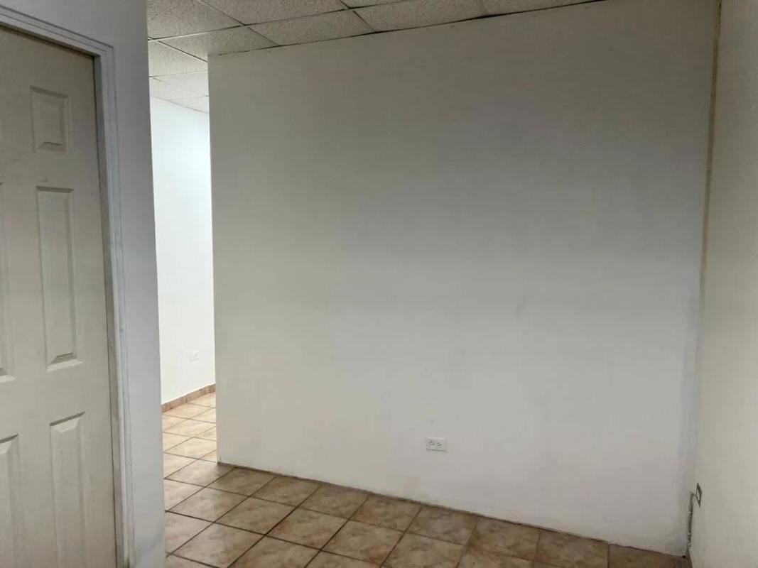 Minimalist white hallway inside commercial office Executive Tower Panama City