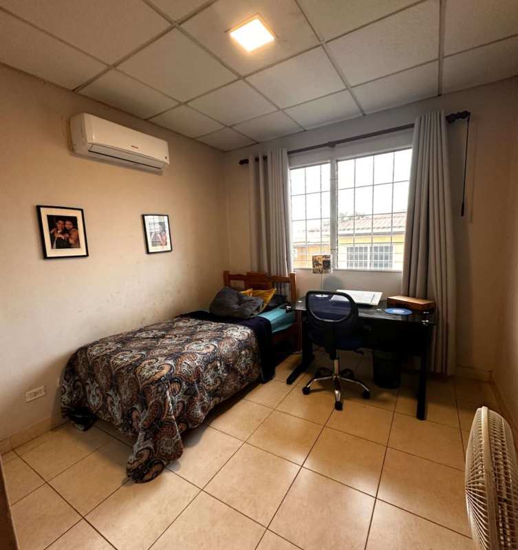 Secondary bedroom with window, closet, AC in Condado del Rey rental home Panama