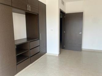 Resort-style pool with sun deck at Cocolí Golf Residences Panama