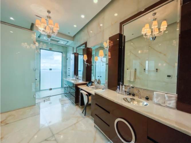 Kitchen with wood cabinetry, granite countertops and ocean views Trump Tower Panama