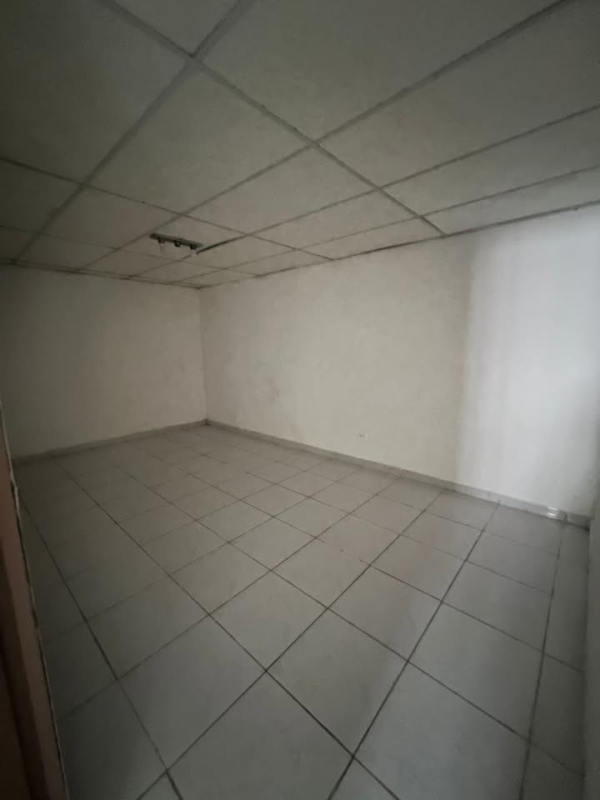 Unfurnished room with tile floor and plain walls Don Bosco house Panama