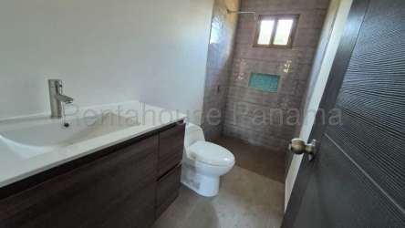 Contemporary bathroom with gray tiled walk-in shower and window in Villa Guadalupe David Panama