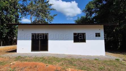 Exterior corner of modern minimalist house with window and gravel path Villa Guadalupe David