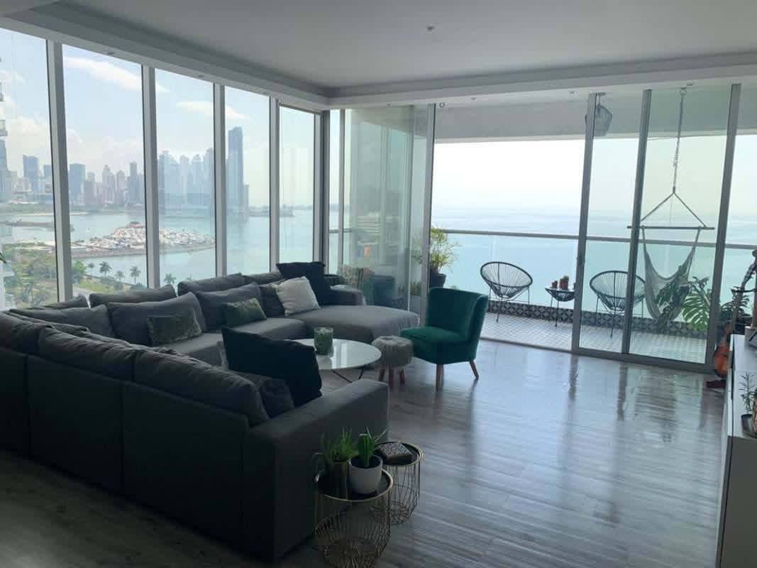 Spacious master bedroom with floor-to-ceiling windows offering ocean skyline views in PH BICSA Tower Panama