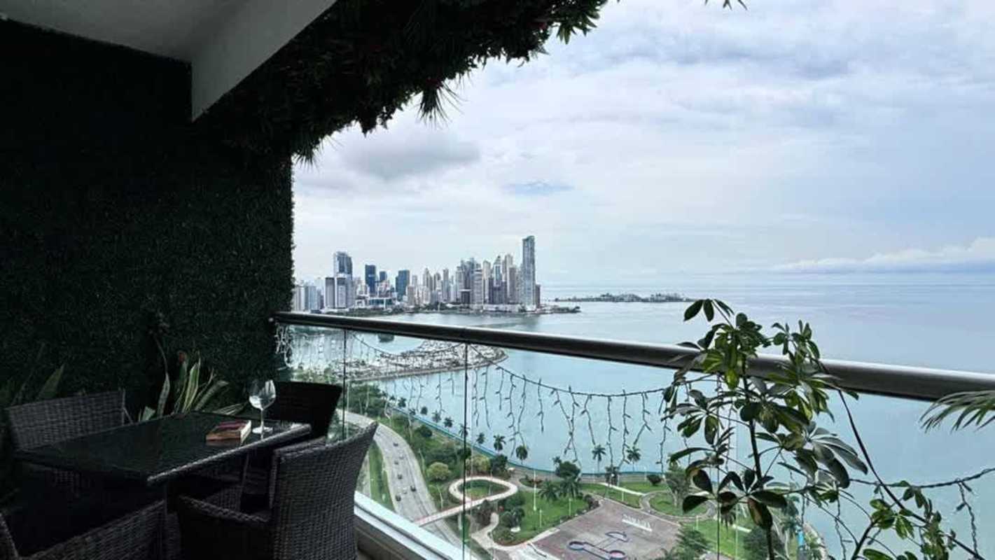 Modern living room with panoramic floor-to-ceiling windows ocean skyline view PH Rivage Panama City