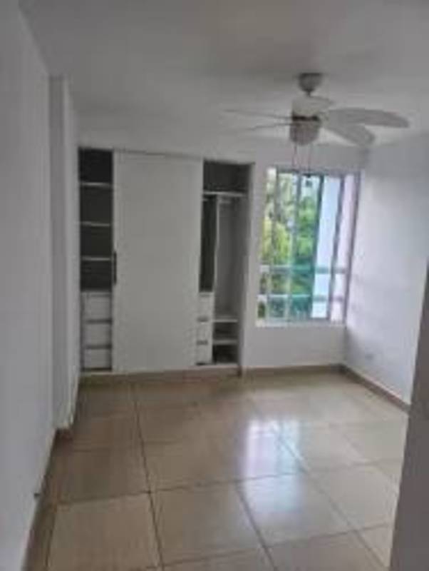 Bedroom space with built-in closet and tiled floors in Carrasquilla Panama