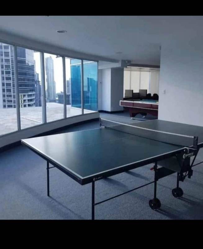 Infinity pool on rooftop terrace with ocean and skyline view at PH Bayfront Tower Panama