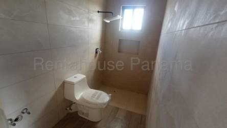 Bathroom with tiled shower area under window in new house in Grand Canyon Boquete Panama