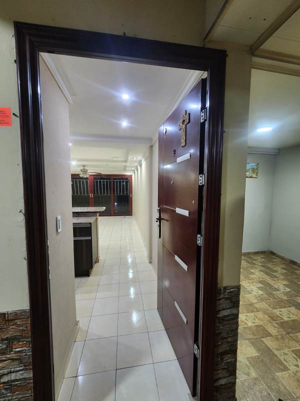 Lobby entrance with security gate and reception area in PH Danli Panama
