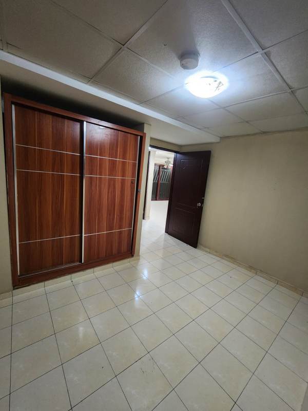 Open kitchen with granite countertop, breakfast bar and tile backsplash PH Danli Panama