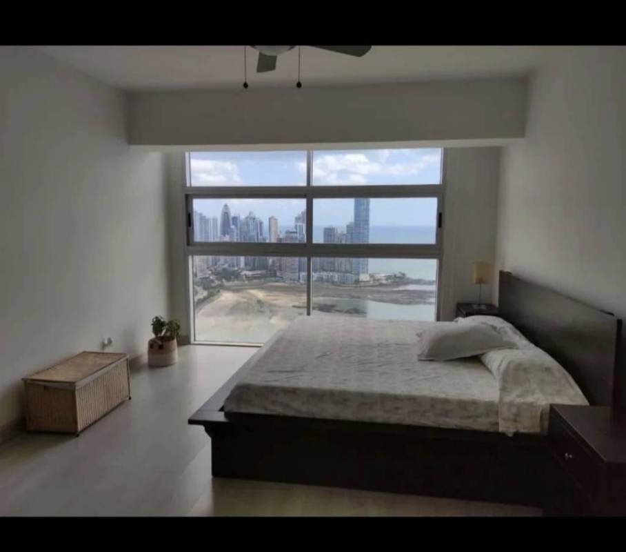 Furnished bedroom featuring city skyline and Pacific Ocean views PH White Tower Panama